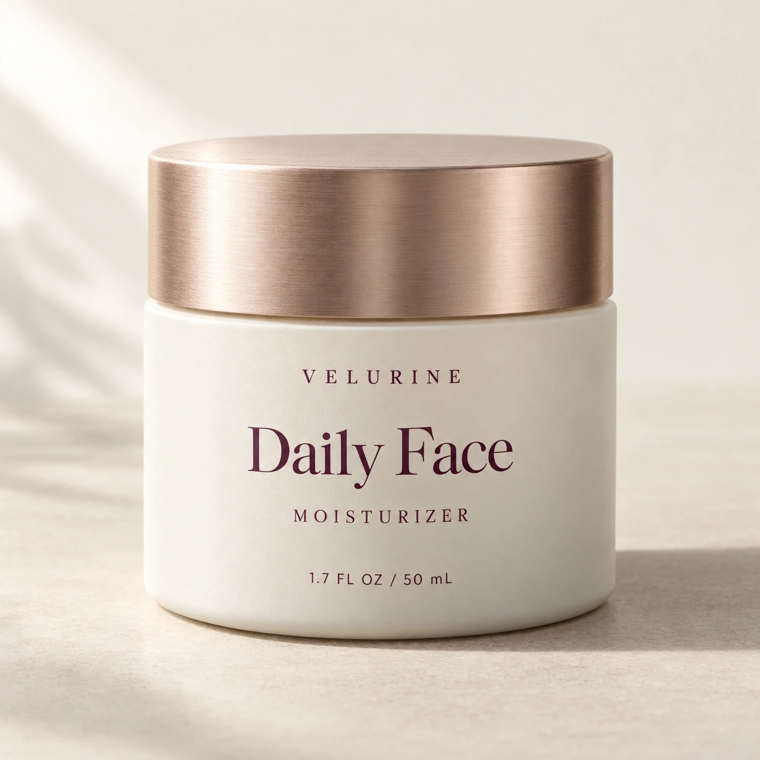 Velurine Daily Face Moisturizer, a 50 mL ivory jar with a rose-gold lid